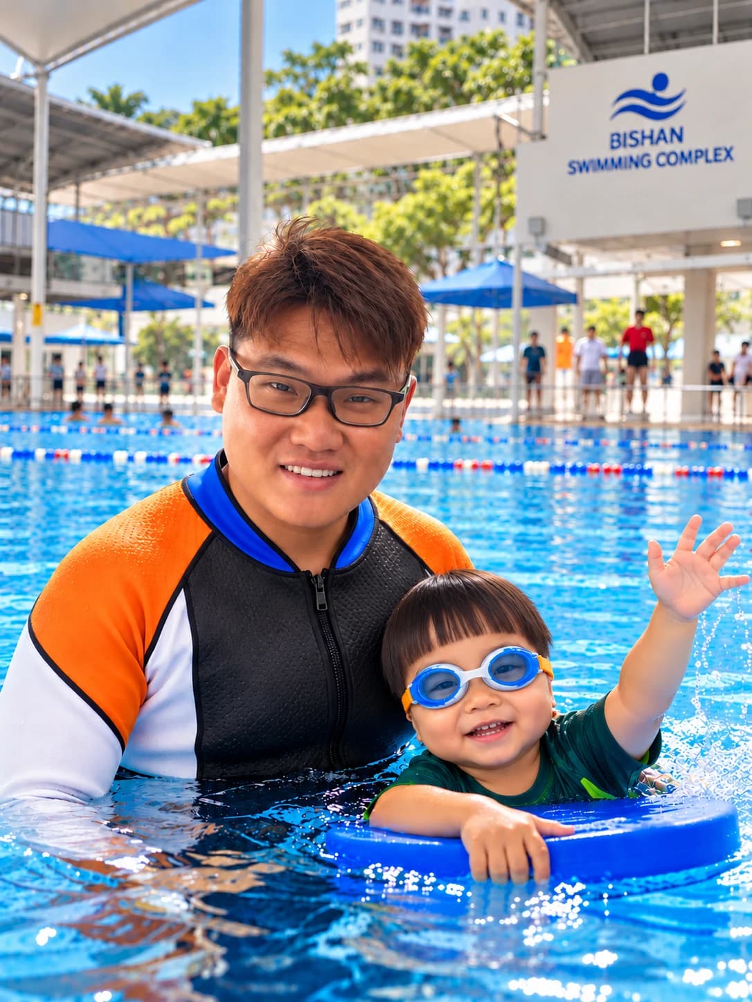 Geniusea coach with a young swimmer on a kickboard at Bishan Swimming Complex
